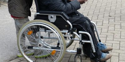 Person being pushed in a wheelchair