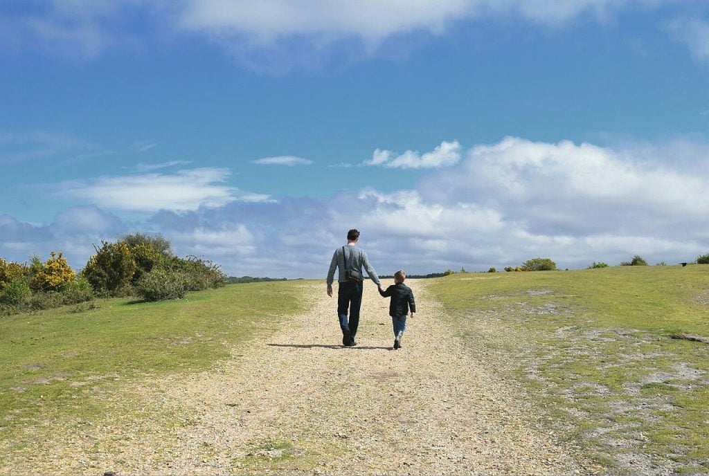 Father and son walking together