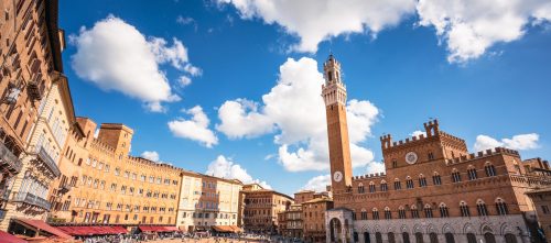 A view of crowds in Siena's Piazza del Campo, an historic town square in the heart of the Tuscan city of Siena.