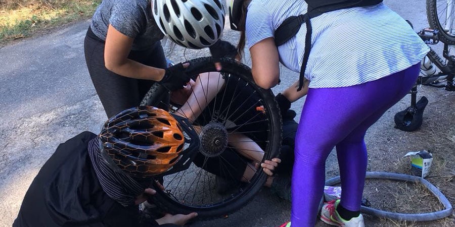 fixing-bike-team-work-camino-de-santiago-caminoways