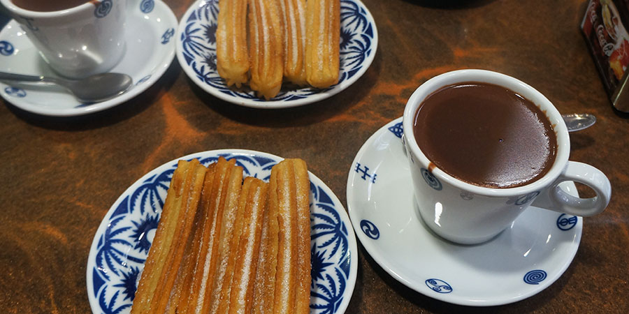 Eating churros with hot chocolate while on the Camino
